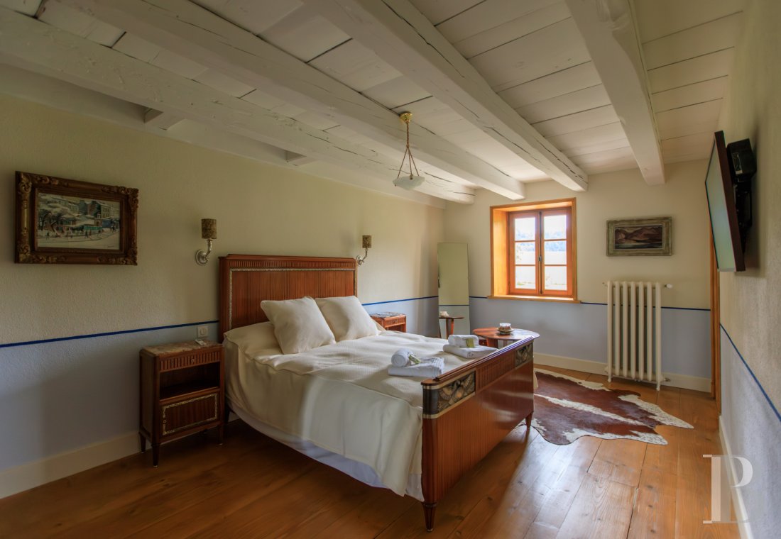 A former livestock farm which has been transformed into a vast, comfortable home near to Nantua in the Haut-Bugey region - photo  n°13